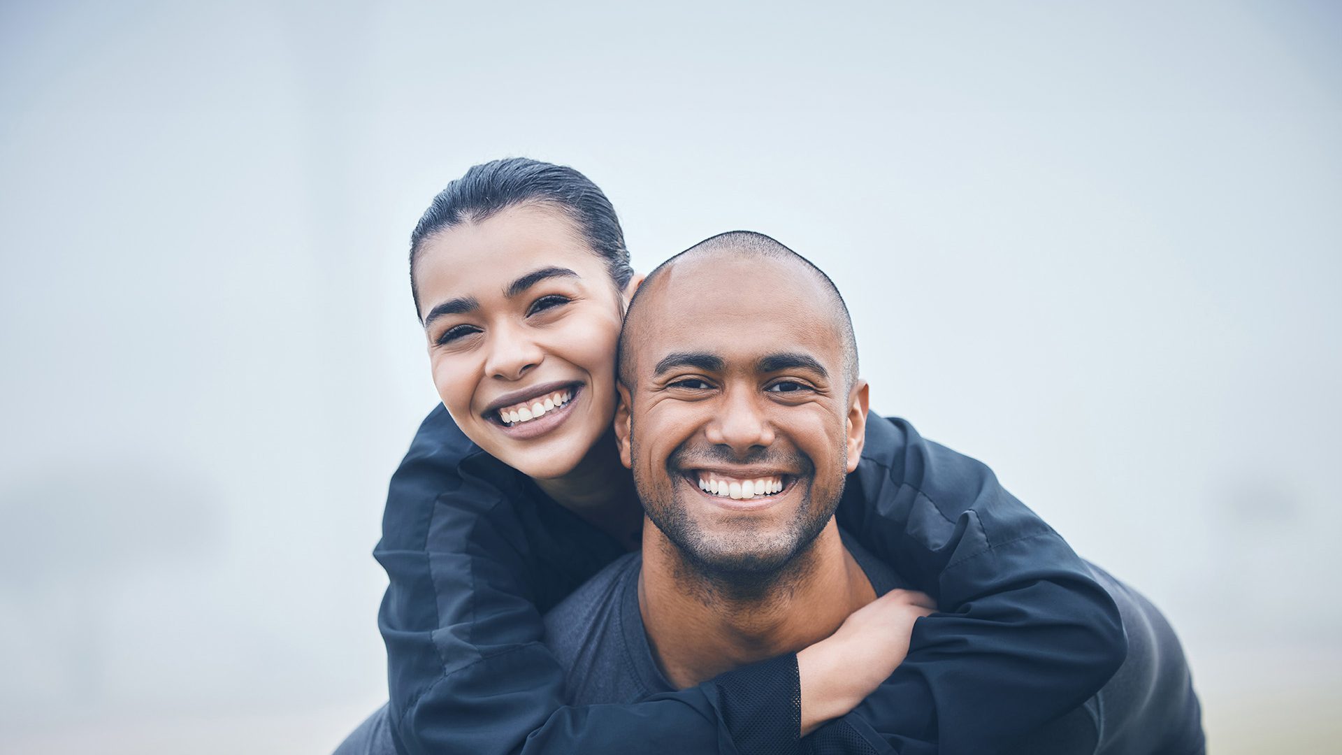 A man and woman smiling for the camera.