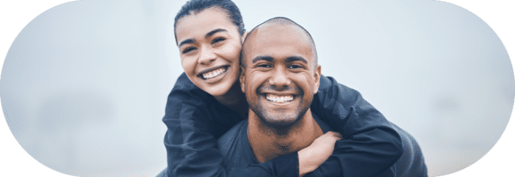 A man and woman smiling for the camera.