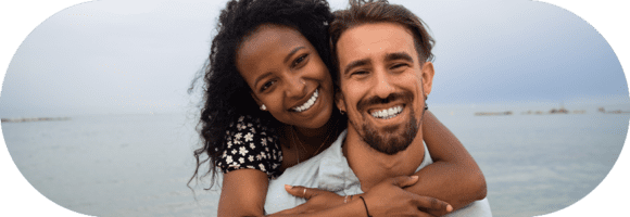 A man and woman smiling for the camera.