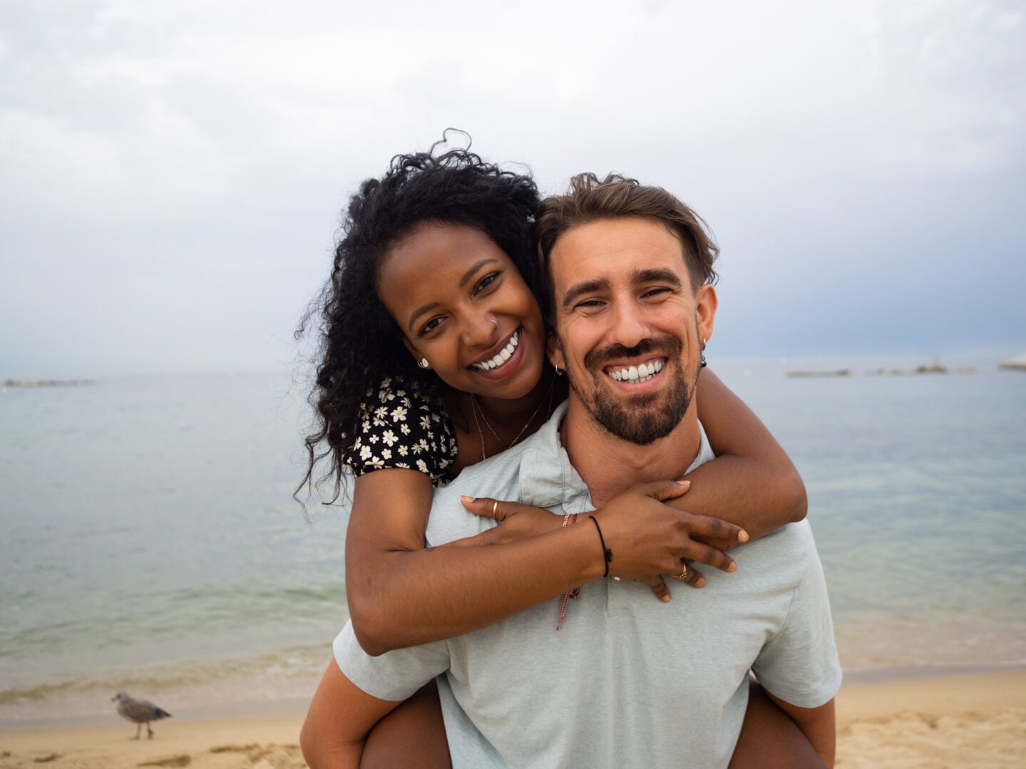 A man and woman are smiling for the camera.